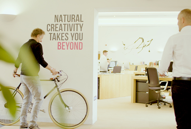 Man holding bike in office