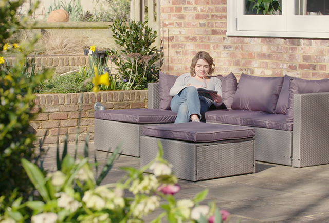 woman sat on garden chair