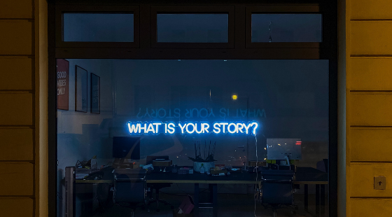 neon story sign in window