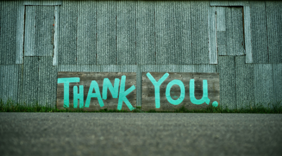 thank you sign on building