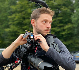 man with camera kit