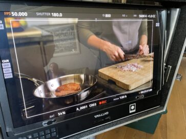 A behind the scenes shot of Gressingham duck sizzling in a pan